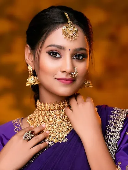 The complete look, showing how the antique choker, jhumkas, and maang tikka come together to create a stunning traditional style.