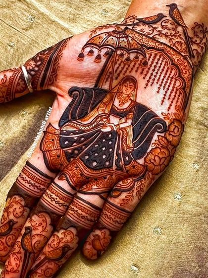 A close-up of a bride in a doli, a classic and elegant motif for bridal mehandi.