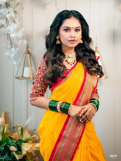 This portrait captures the elegance of a traditional Maharashtrian look, with a focus on the nath and bindi.