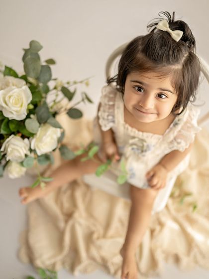 Another angle of this adorable sitter session. That little smile is everything.