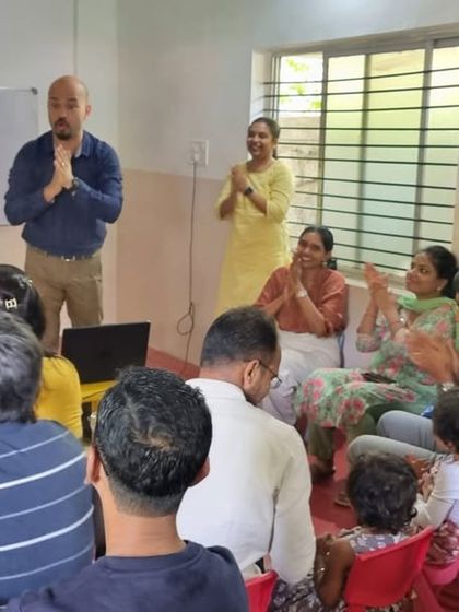 A father addresses the room during our Parent Orientation Day. We encourage open communication and active participation from all members of our school community.