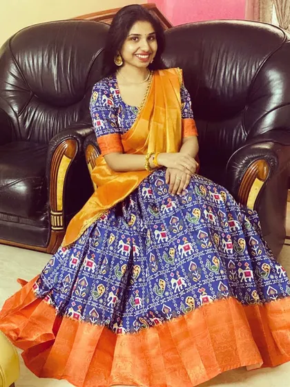 The gorgeous Monisha in a custom-made half saree. I used a traditional Patola print for the lehenga and paired it with a contrasting orange border and dupatta for a vibrant, festive look.