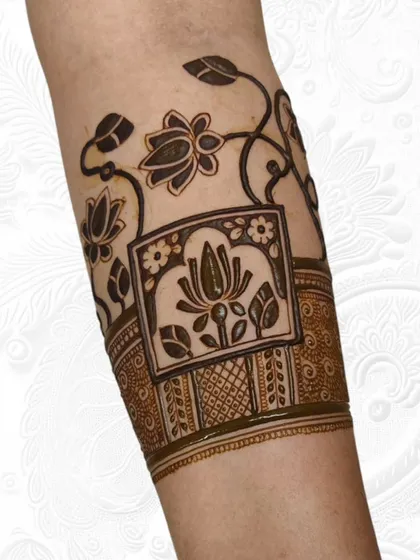 The same lotus armband design after the filling and shading is complete. This shows how we build layers and textures to bring the henna art to life.