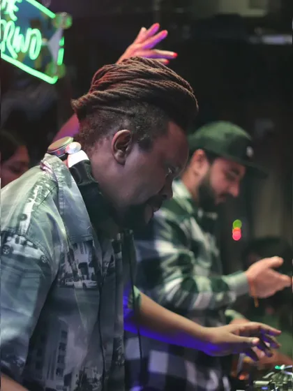 My MC, Bobkat, focused on his craft, with another DJ in the background. It's a team effort.