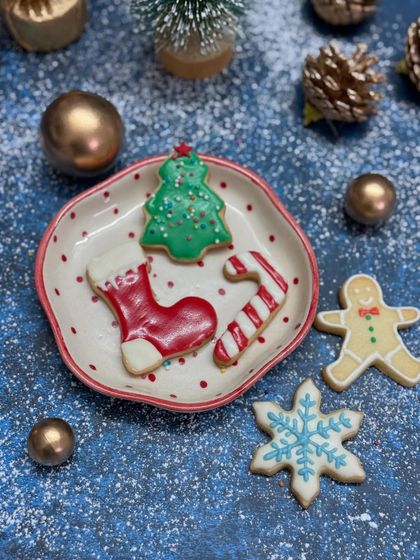 It's beginning to feel a lot like Christmas with these decorated sugar cookies, featuring shapes like stockings, candy canes, trees, and gingerbread men.