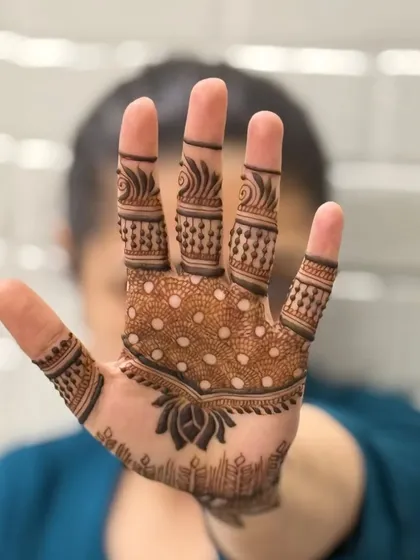 A candid shot showing the detail of this modern dotted mehendi design.