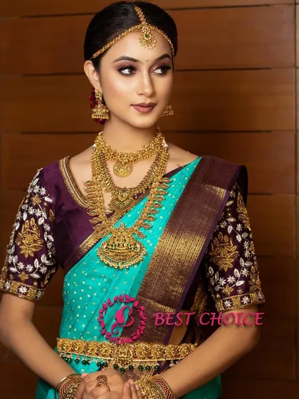 A three-quarter view of the model, showcasing the full effect of the jewellery with the elegant saree.