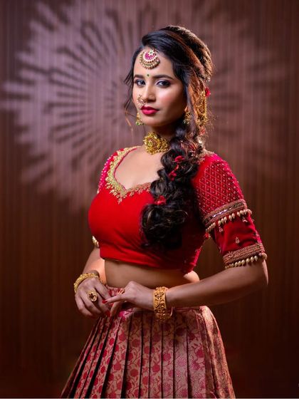 This series features a model in a red lehenga, wearing a simple but elegant gold-toned choker set. This is a great option for a pre-wedding puja or sangeet.