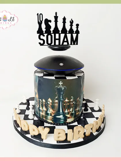 Checkmate! This unique chess-themed cake defies gravity with a levitating topper, creating an unforgettable "wow" factor. The edible chessboard and detailed pieces make it the perfect centerpiece for a strategic thinker's birthday.