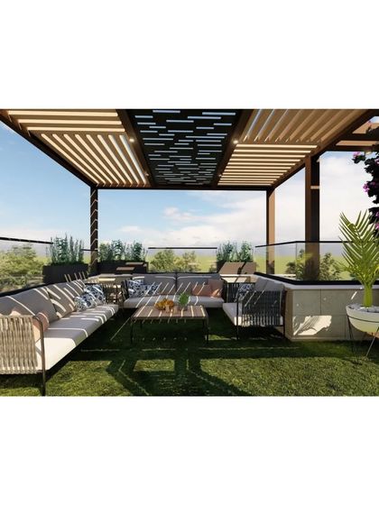 A beautiful rooftop garden with an artificial lawn, providing a lush green space for relaxation. The modern pergola features a laser-cut patterned roof, creating beautiful light and shadow effects.