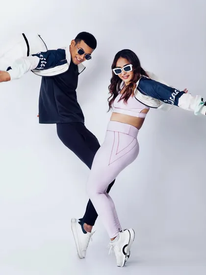 A high-energy, synchronized pose that brings a sense of fun and dynamism to the brand's campaign. This is great for social media content.