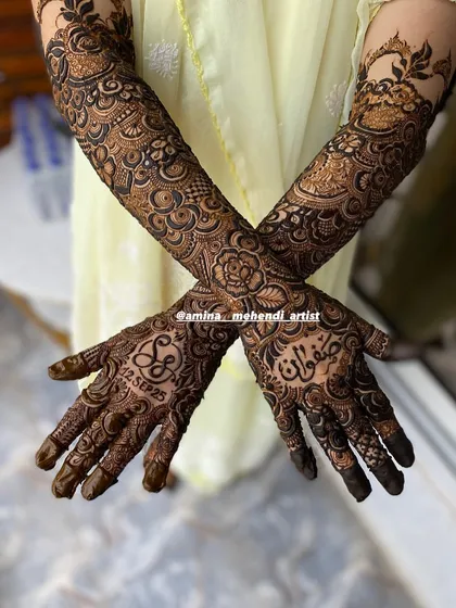 A crossed-hands pose showing the personalized design with the date and initials.