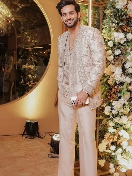 The blush pink indowestern set seen in a full-length shot, highlighting the relaxed yet formal feel.