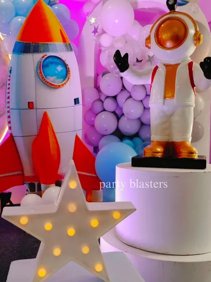 A close-up of our custom-made astronaut and rocket ship props, which are key elements in bringing the space theme to life.
