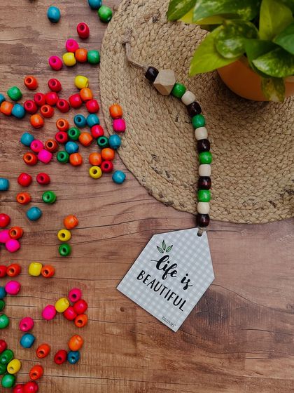 Our best-selling beaded huts are available for just ₹299 each. This 'Life is Beautiful' hut is a great example of the ten hand-doodled designs we offer, perfect for gifting or decorating a small corner.