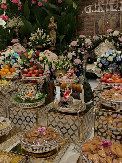 Another angle of the colorful offering table, showing the intricate details of the props and arrangements.