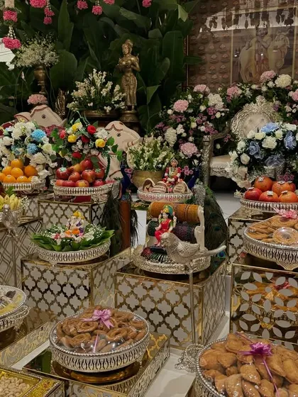 Another angle of the colorful offering table, showing the intricate details of the props and arrangements.