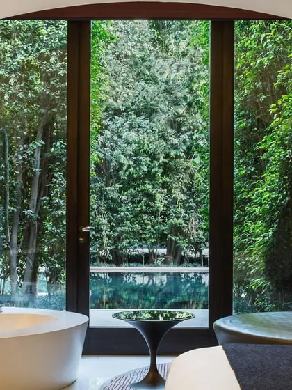 Our rooms are designed to bring the outdoors in. This view from one of our suites looks out onto the resort's lush trees and water bodies, reminding you that you are in a tranquil oasis.