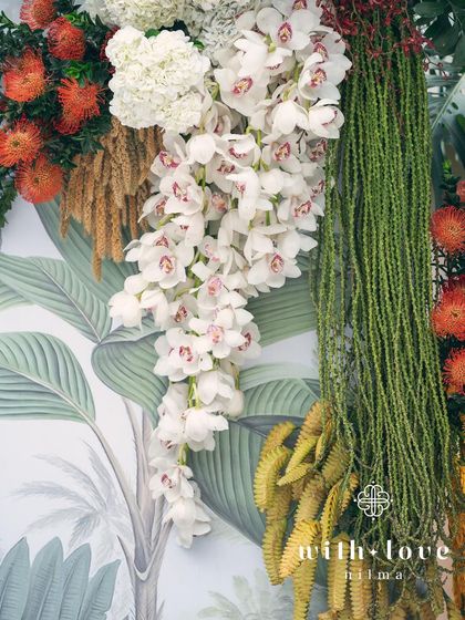A close-up of the cascading white orchids from the 'Garden of Gaia' floral wall.