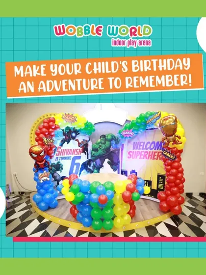 A wide shot of our superhero party decor. The "Welcome Superheroes" sign, character cutouts, and colorful balloon columns set the stage for an adventurous day.