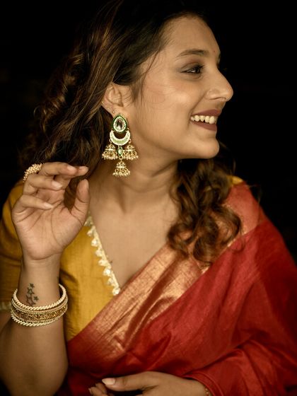 A happy, smiling profile shot that captures the joy of the festive season and my love for traditional wear.