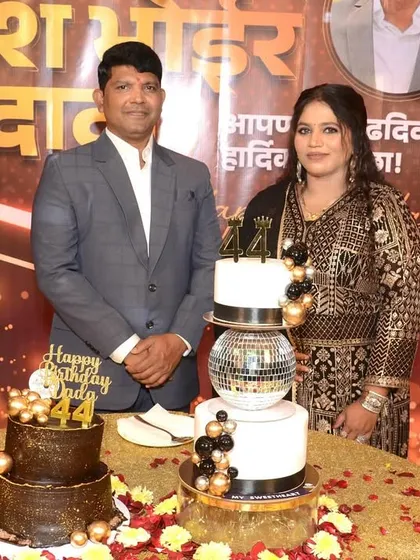 The happy couple celebrating a 44th birthday with two of our custom cakes, one with a disco ball and another with a rich chocolate finish.