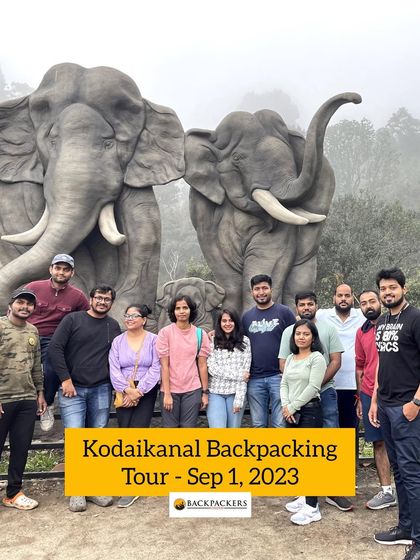 Our Kodaikanal group posing with elephant statues, a fun photo stop on the tour.