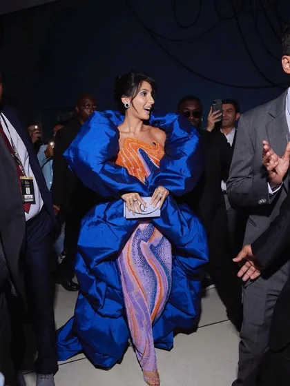 For Nora Fatehi's main IIFA 2023 appearance, we went for high drama with this structural Jean-Pierre Khoury gown. The voluminous royal blue wrap over a psychedelic-print catsuit was a bold fashion choice that truly owned the carpet.