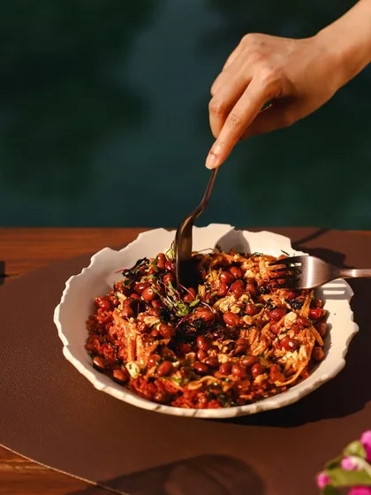 A guest enjoys a hearty and flavorful dish, a testament to our commitment to culinary excellence.