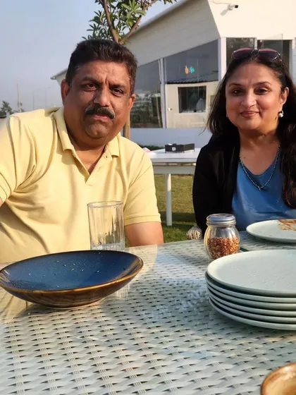 A couple enjoying a meal at our outdoor cafe after a session on the range. It's the perfect way to complete your visit.