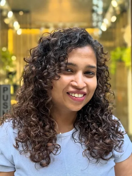 This before-and-after series shows the transformation to Chocolate Caramel Highlights. I focused on adding brightness around the face and through the lengths for a sun-kissed effect.