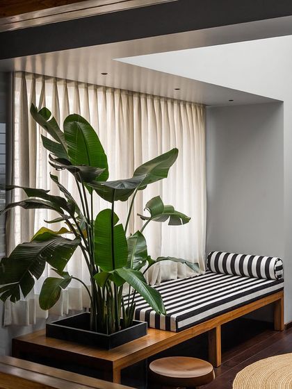 A view of the master bedroom lounge, showing the custom bench and planter I designed. My goal is to create furniture that is both practical and beautiful, enhancing the room's connection to natural light and life.