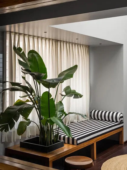 A view of the master bedroom lounge, showing the custom bench and planter I designed. My goal is to create furniture that is both practical and beautiful, enhancing the room's connection to natural light and life.
