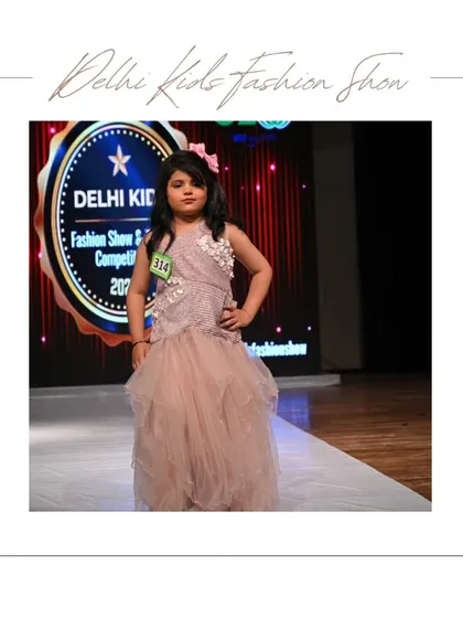 Posing with confidence, this participant shines in a dusty rose gown with beautiful floral details. I encourage every child to find their power pose and own their moment on the runway.