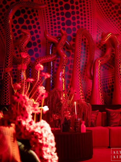 A closer look at the Kusama-inspired installations, where organic, sculptural forms are covered in hypnotic dot patterns. The intense red lighting and dramatic shapes created a powerful, otherworldly atmosphere for the sangeet night.