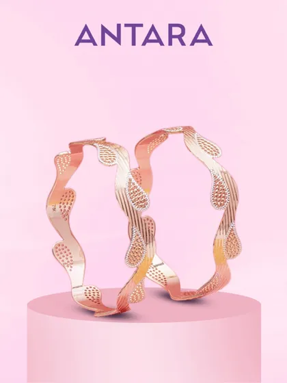 Not just bangles, but poetry in gold. Intricately etched paisley motifs dance across these 22KT matte gold bangles, creating depth and dimension that is a testament to true artistry.