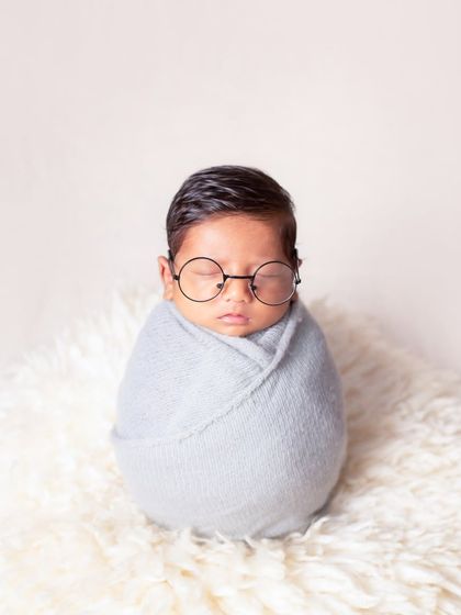 Mr. Perfect! A simple swaddle and some cute glasses make for such a fun and memorable newborn photo.