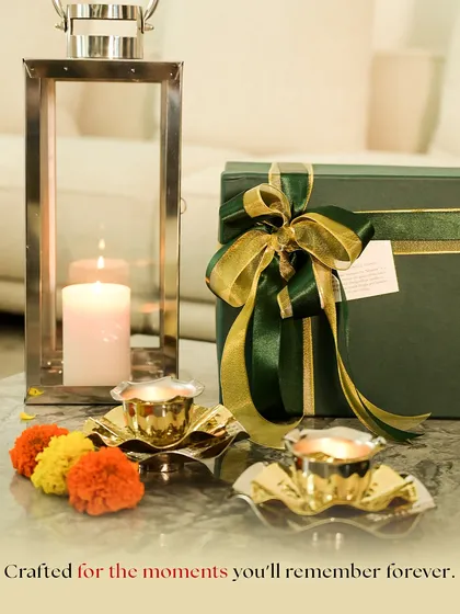 Crafted for moments you'll remember forever. This image captures the warm glow of our festive lanterns and diya plates, showcased as part of our wedding gifting collection, perfect for adding ambiance to any celebration.