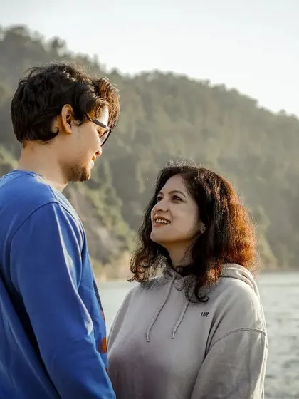 A candid, relaxed moment from a pre-wedding shoot by the water. We aim to capture your natural connection and comfort with each other.
