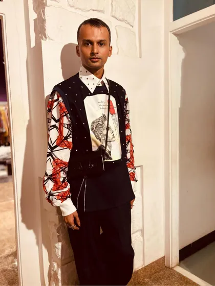 Sanjay Dauhalia in my Matrix Set. This futuristic ensemble includes a holographic printed pullover with metal embellishments and a uniquely printed shirt, designed for a bold, daring night-out look.
