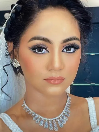 A close-up of a stunning Arabic-inspired bridal look. The sharp, winged eyeliner and the bright white waterline are hallmarks of this style, creating a captivating and dramatic gaze.