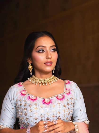 This look captures the fresh, pastel vibes of a carnival theme. The makeup is kept bright and clean with a statement blue liner to let the colorful outfit shine.