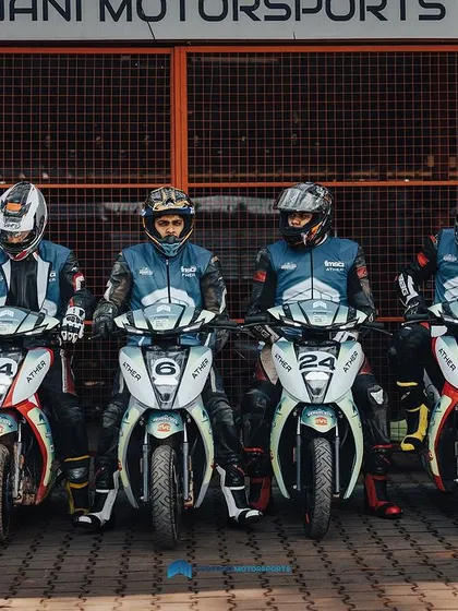 A line of racers waiting in the pit area, focused and ready to go. We help train these riders to build their confidence and skill for the competition.