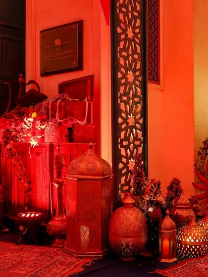 A wider view of the treasure corner, showing the use of Persian-style rugs and a variety of lanterns to create a rich, layered look.
