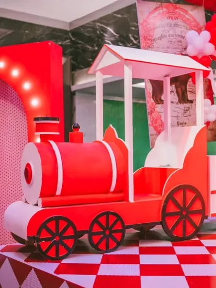 All aboard the party express. This custom-built red train was a highlight of the circus theme, serving as both a fantastic photo opportunity and a central piece of the imaginative decor.
