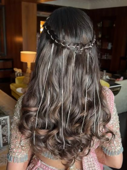 Another view of the beautiful stone string hairstyle, a unique and modern accessory choice for a pre-wedding event.