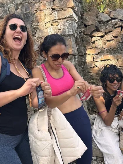 Sharing a laugh and a snack on the trail. These small, candid moments of connection during our hikes are what build the strong sense of community in our group.