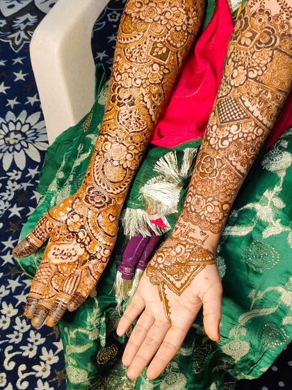 A view of both arms, showing how the intricate patterns wrap all the way around. This design is packed with detail from the wrist to the elbow.