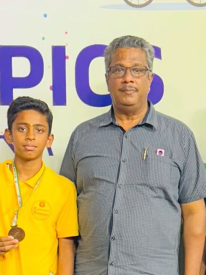 One of our coaches with young medal winners at the Mini Olympics. We guide our students at every step, from training in the dojang to competing on the main stage.