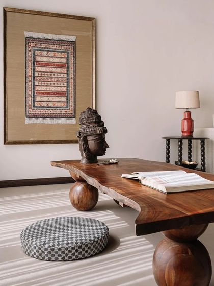 The 'Memorabilia House' by Aditi Sharma Design Studio is a duplex rooted in Indian sensibilities, featuring a low seating area with a live-edge table and traditional art.